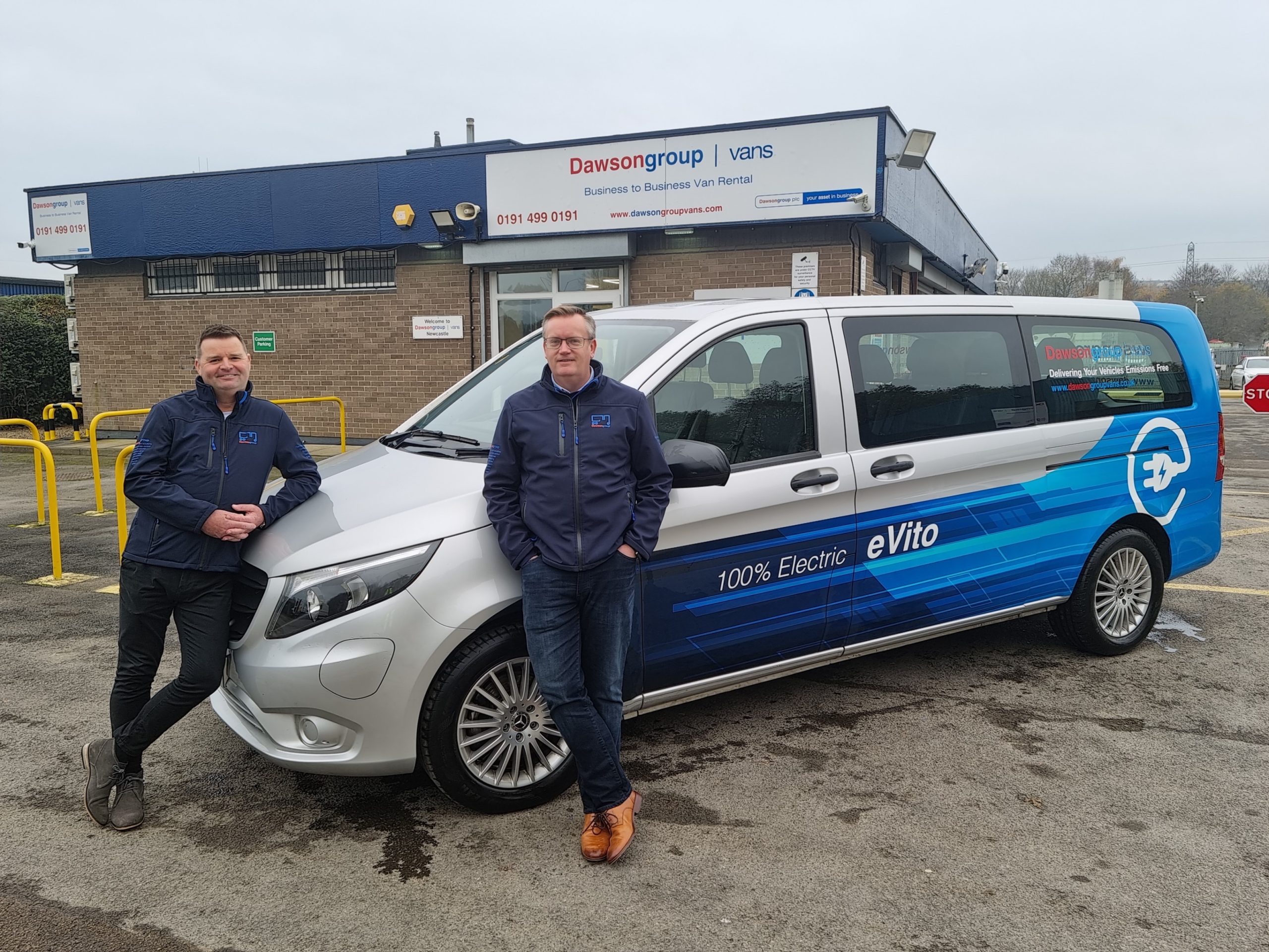 Mark Dixon and Trevor Mewes standing in front of evito van and Dawsongroup branch