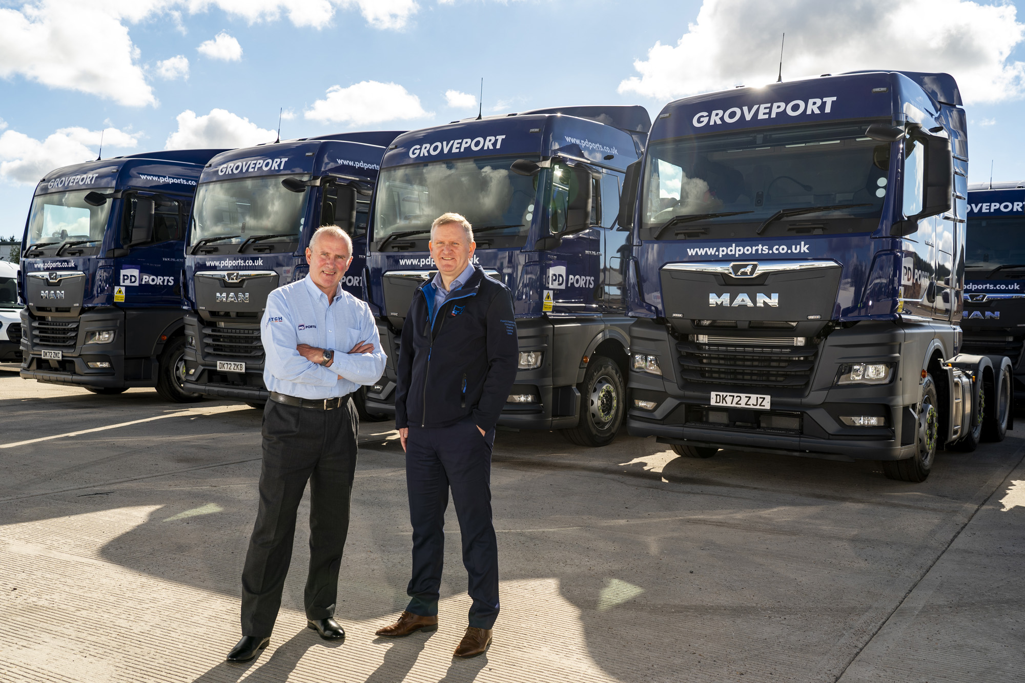 PD Ports - Gary Archer and Nigel Holmes standing in front of trucks