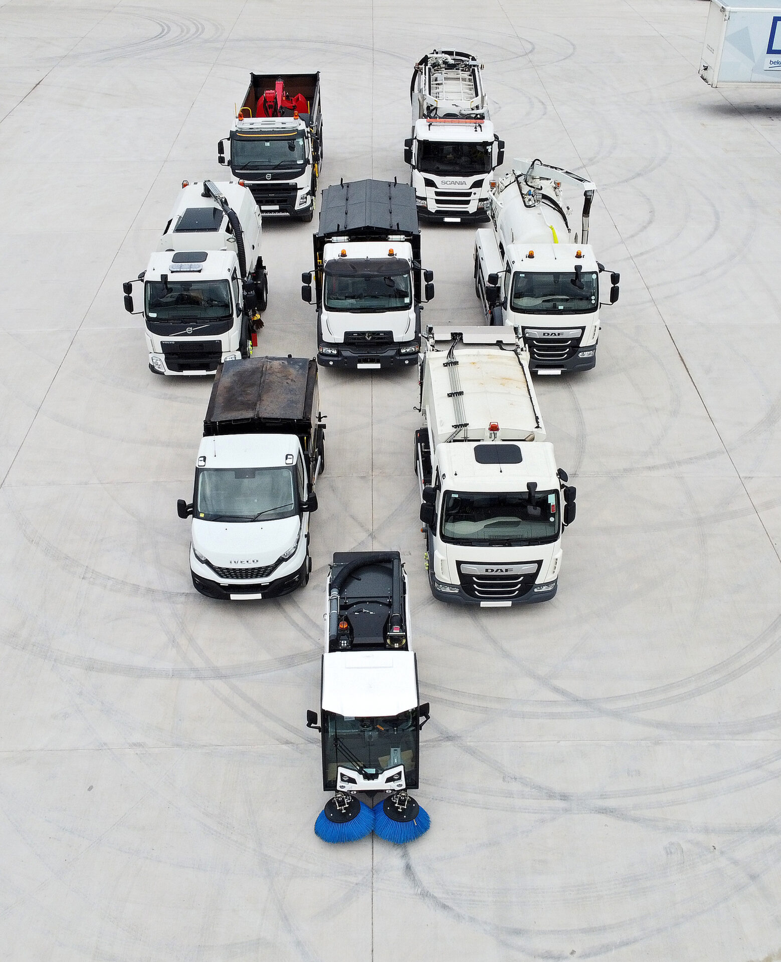 EMC Surface Dressing Demand - aerial view of sweepers and street cleaning vehicles