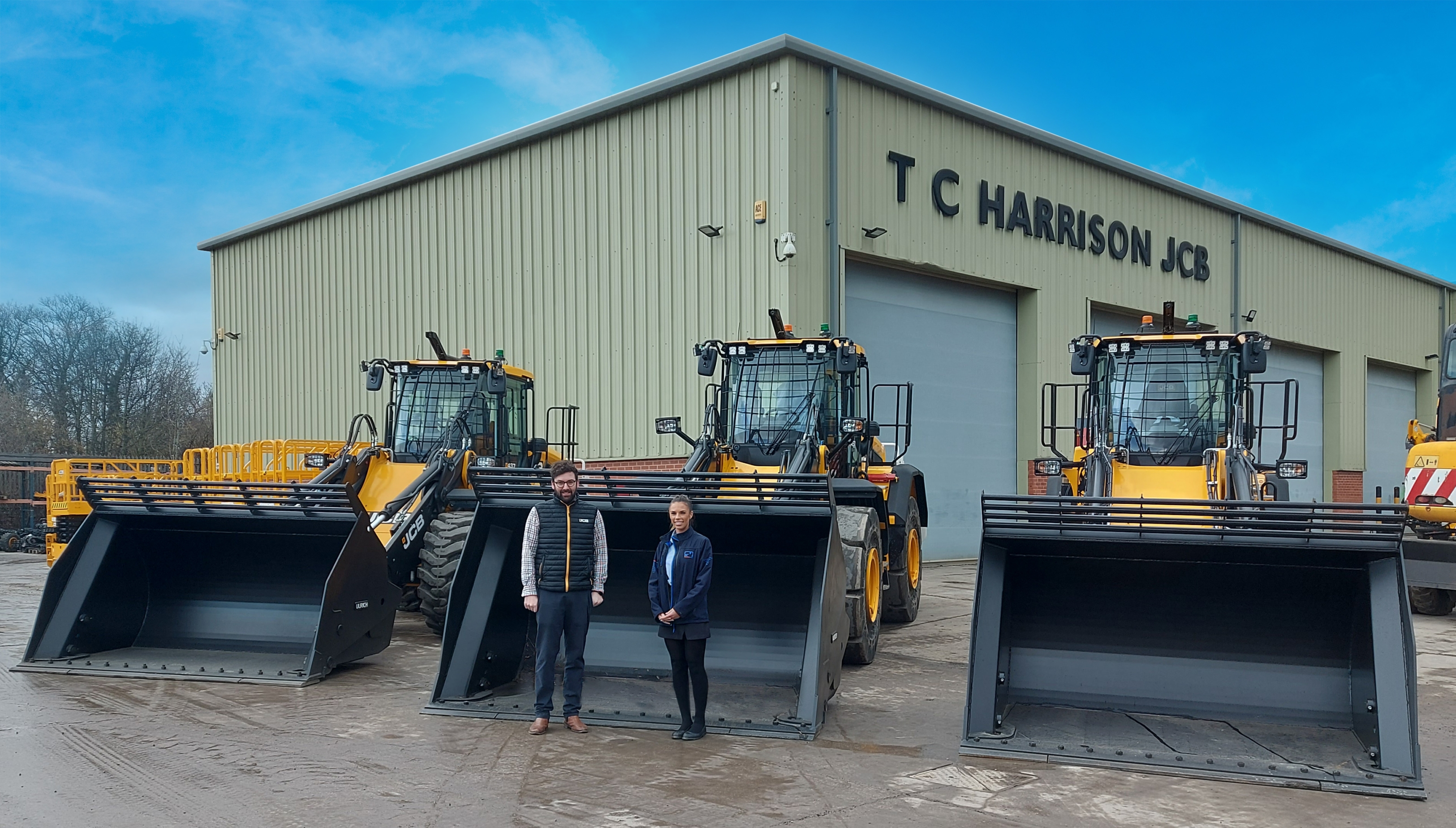 Sarah Black in front of 3 JCB Wastemasters