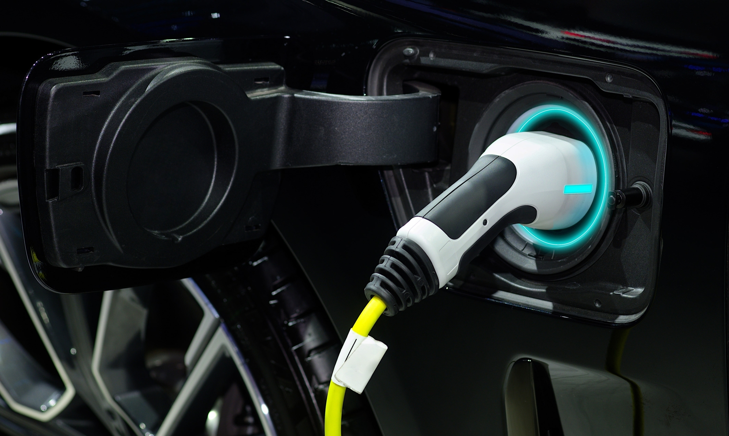 Zero Emissions Mandate - close up of EV plug