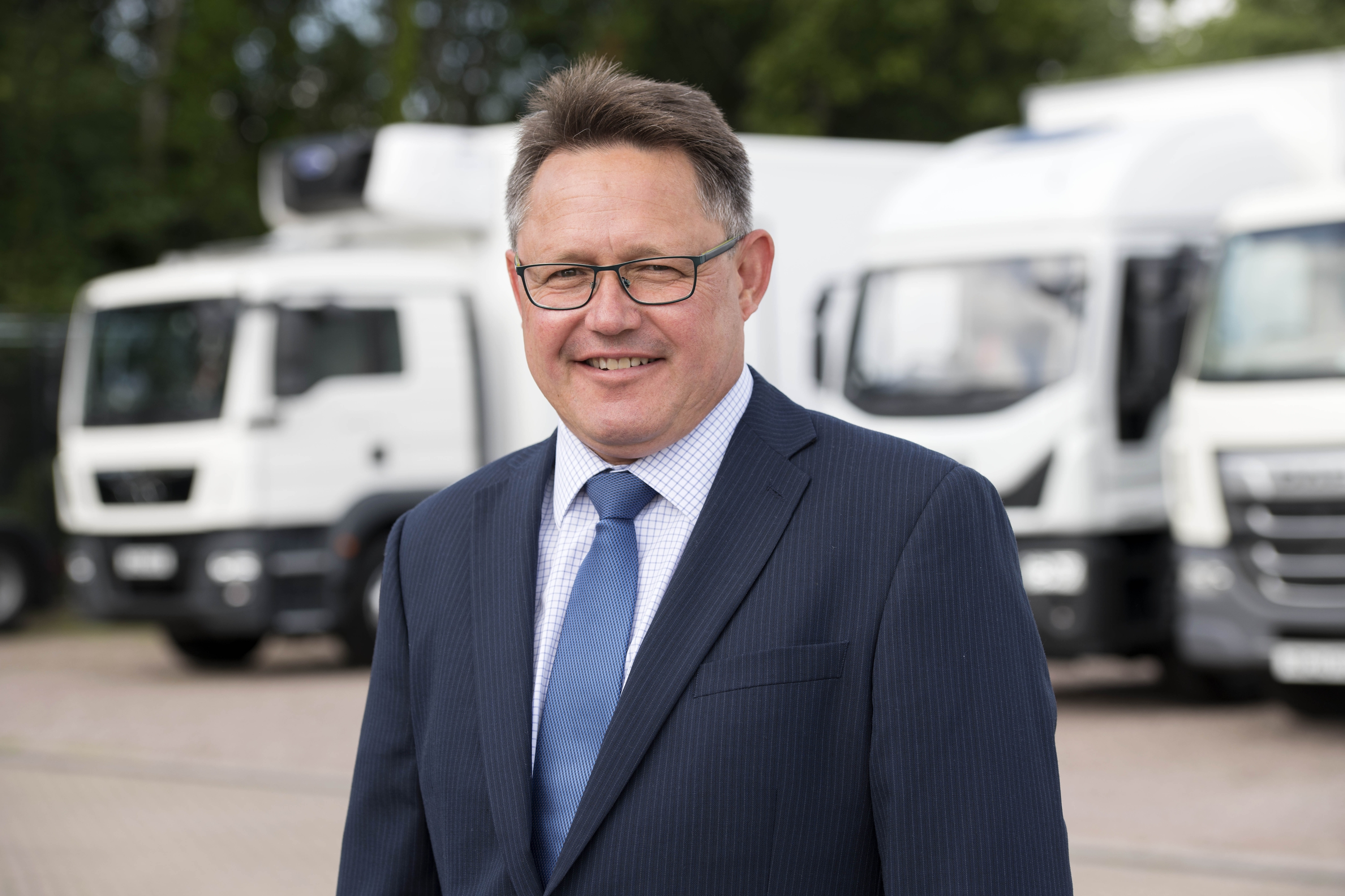 James Hunter in Front of a Truck considering the proposal for replacing Transport Commissioners