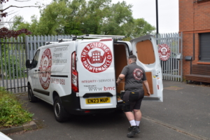 The Building Maintenance Company vans being packed