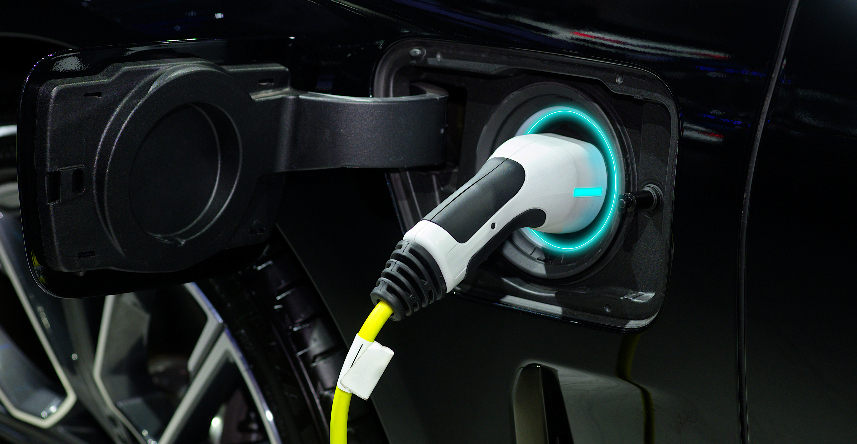 Dawsongroup vans' introduction to maintaining your electric vans. Image of an electric charger.